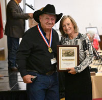 Mike Fletcher Jr. & Sr. Accepting Plaque